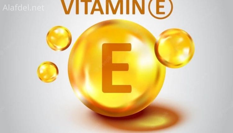 صورة بها دائرة صفراء فيها حرف e مكتوب فوقها Vitamin E وذلك ضمن فوائد الفيتامين ھ